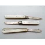 Three George V silver and mother of pearl folding fruit knives, all Sheffield assay,