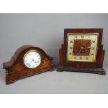 An oak cased art deco style mantel clock with Arabic numerals and a Haller movement and a further