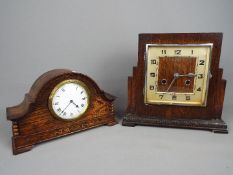 An oak cased art deco style mantel clock with Arabic numerals and a Haller movement and a further