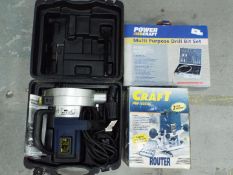 A Powercraft wall chaser in case, a boxed Powercraft router and a multi purpose drill bit set.