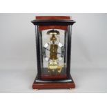 A Sewills of Liverpool skeleton type brass mantel clock with Hermle movement numbered 791-081,