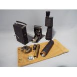 A Lieberman & Gortz 25 x 52 monocular containe in canvas bag, a Kodak Vest Pocket model B,