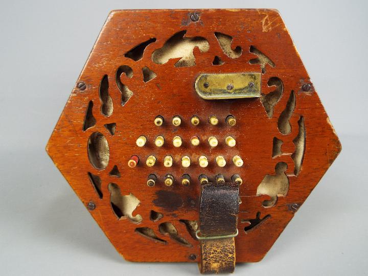 A Lachenal & Co 48 button concertina with hexagonal fretworked ends, - Image 2 of 5