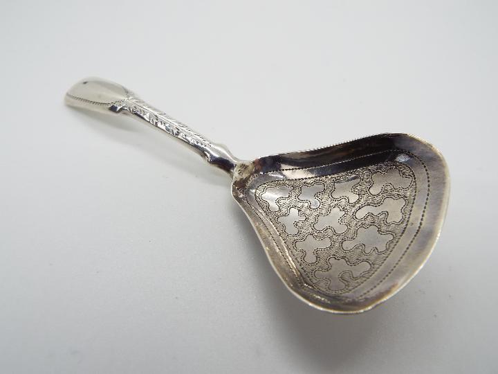 A George III hallmarked silver caddy spoon, Birmingham assay 1814, makers mark for William Pugh,