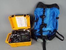 A Megger Pat2 appliance tester and a rucksack.