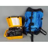 A Megger Pat2 appliance tester and a rucksack.