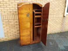 A 1960's gentleman's wardrobe with fitted interior by Supersuite Production,