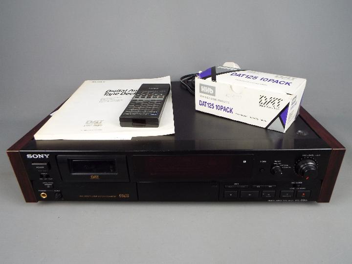 A Sony DAT, Digital Audio Tape deck, model 59ES, with remote and box of blank tapes.
