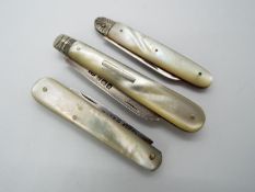 Three Victorian silver and mother of pearl folding fruit knives, all Sheffield assay,