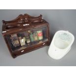 A display of vintage chemist's products and similar and a 'New Slipper Ben Pan'.