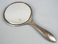 A George V silver hallmarked dressing table hand mirror, Chester assay 1923,