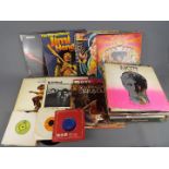 In excess of sixty 33 RPM vinyl records to include Jimi Hendrix, Hawkwind, Fleetwood Mac,