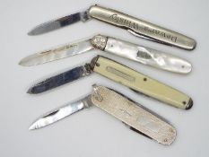 A small collection of knives to include a Victorian silver and mother of pearl example.