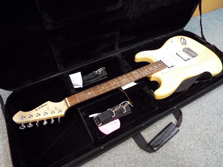 An Aria six string STG Series, Stratocaster type, electric guitar with carry case.