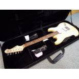 An Aria six string STG Series, Stratocaster type, electric guitar with carry case.