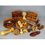 A collection of treen, desk tidies, bowls and similar.