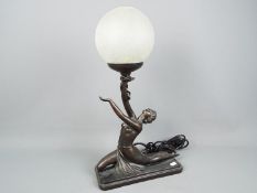 A bronzed Art Deco style figural table lamp, marked 'Crosa 1998', approximately 48 cm (h).
