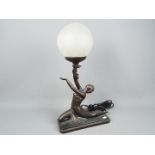A bronzed Art Deco style figural table lamp, marked 'Crosa 1998', approximately 48 cm (h).