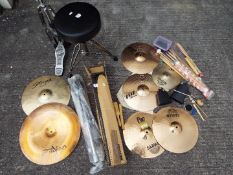 A quantity of drumming related equipment to include stool, hi-hat, cymbal stand,