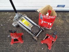 Three axle stands and a 2 1/4 ton Hydraulic Garage Jack.