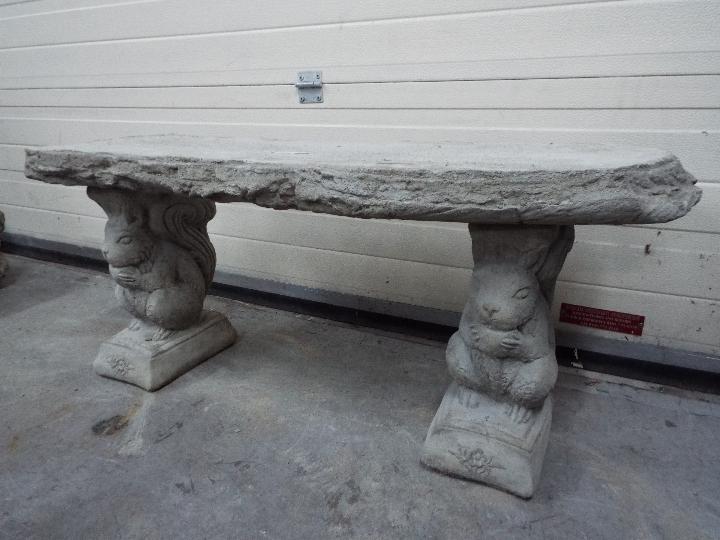 Garden Stoneware - A reconstituted stone garden bench with a timber effect seat and plinths in the