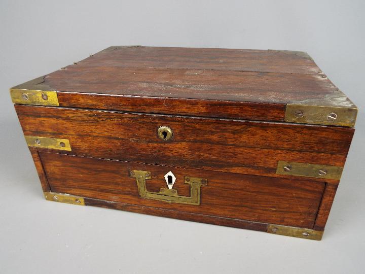 A vintage, campaign style correspondence / work box, brass mounted with flush drawer handle,