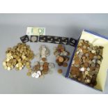 A large quantity of UK and foreign coins, commemorative crowns and similar.