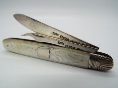 An Edward VII silver and mother of pearl folding fruit knife and pick,