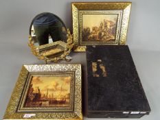 A vintage metal deed box, bevel edge dressing table mirror and two decoratively framed prints.