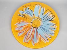 A large Andy Warhol 'Daisies' plate for Rosenthal, orange ground,