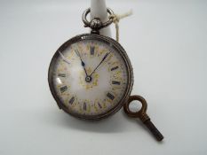 A lady’s silver cased pocket watch, case having engraved decoration,
