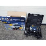 A boxed Powercraft 90W Scroll Saw and a Powercraft SDS and Rotary Hammer Drill in case.