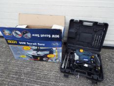 A boxed Powercraft 90W Scroll Saw and a Powercraft SDS and Rotary Hammer Drill in case.