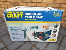 A boxed Powercraft circular table saw.