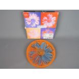 An Andy Warhol 'Daisies' plate for Rosenthal, orange ground, in original box. Approximately 19.