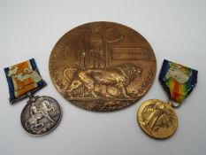 A World War I (WW1) medal group comprising War Medal, Victory Medal and Death Plaque,