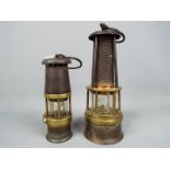 Two safety lamps to include a Wolf Safety Lamp Co Baby Wolf Lamp and one other stamped