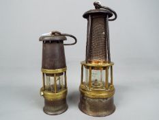 Two safety lamps to include a Wolf Safety Lamp Co Baby Wolf Lamp and one other stamped