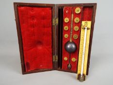A mahogany cased Sikes' Hydrometer with T. O. Blake label to lid.