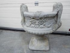 Garden Stoneware - A large reconstituted stone two handled decorative urn planter in two pieces