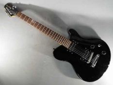 An electric guitar finished in satin black, branded by Indie, with soft carry case.