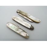 Three George V silver and mother of pearl folding fruit knives,