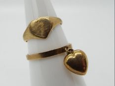 A 9ct gold 'Heart' signet ring, size I 1/2 and a 9ct gold heart pendant ring, size N 1/2,