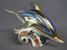 Royal Crown Derby - A Royal Crown Derby paperweight in the form of a dolphin, gold stopper,