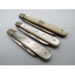 Three George V silver and mother of pearl folding fruit knives, all Sheffield assay,