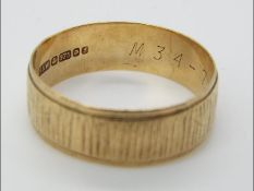 A 9ct yellow gold hallmarked wedding band, size T, approximately 2.99 grams all in.