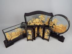 Four large Chinese carved cork landscape dioramas, in cases,