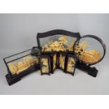 Four large Chinese carved cork landscape dioramas, in cases,