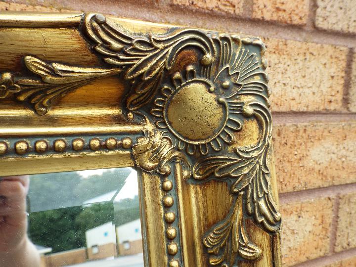 Two decorative gilt framed wall mirrors, largest approximately 76 cm x 106 cm. - Image 3 of 5