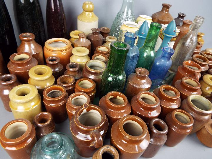 A collection of stoneware and glass bottles and pots, early to mid 20 th century, - Image 4 of 4